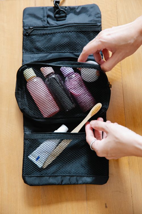 Travel toiletry bag packed with a toothbrush and personal-care items