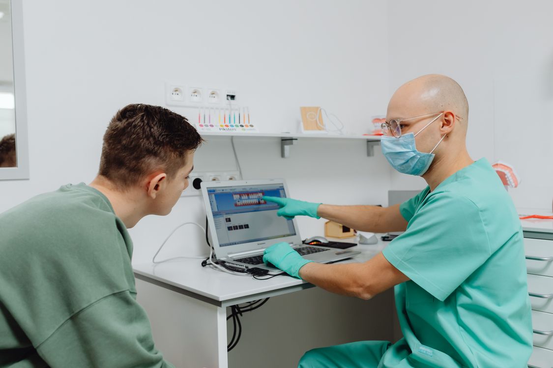 Dentist discussing dental findings and a treatment plan with a patient