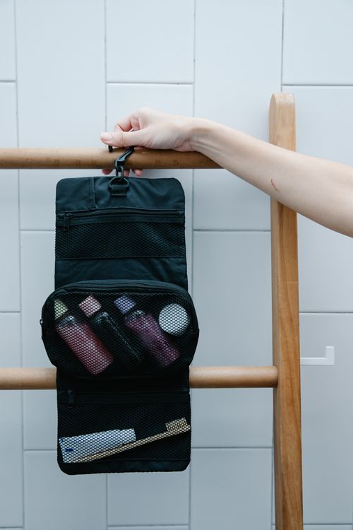 Portable travel toiletry kit with a toothbrush for a holiday road trip