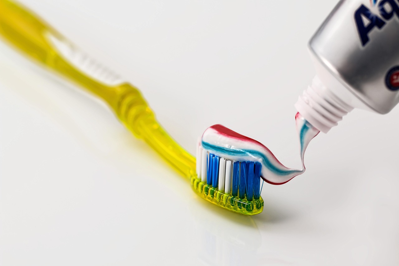 Toothbrush with fluoride toothpaste ready for a daily dental-care routine