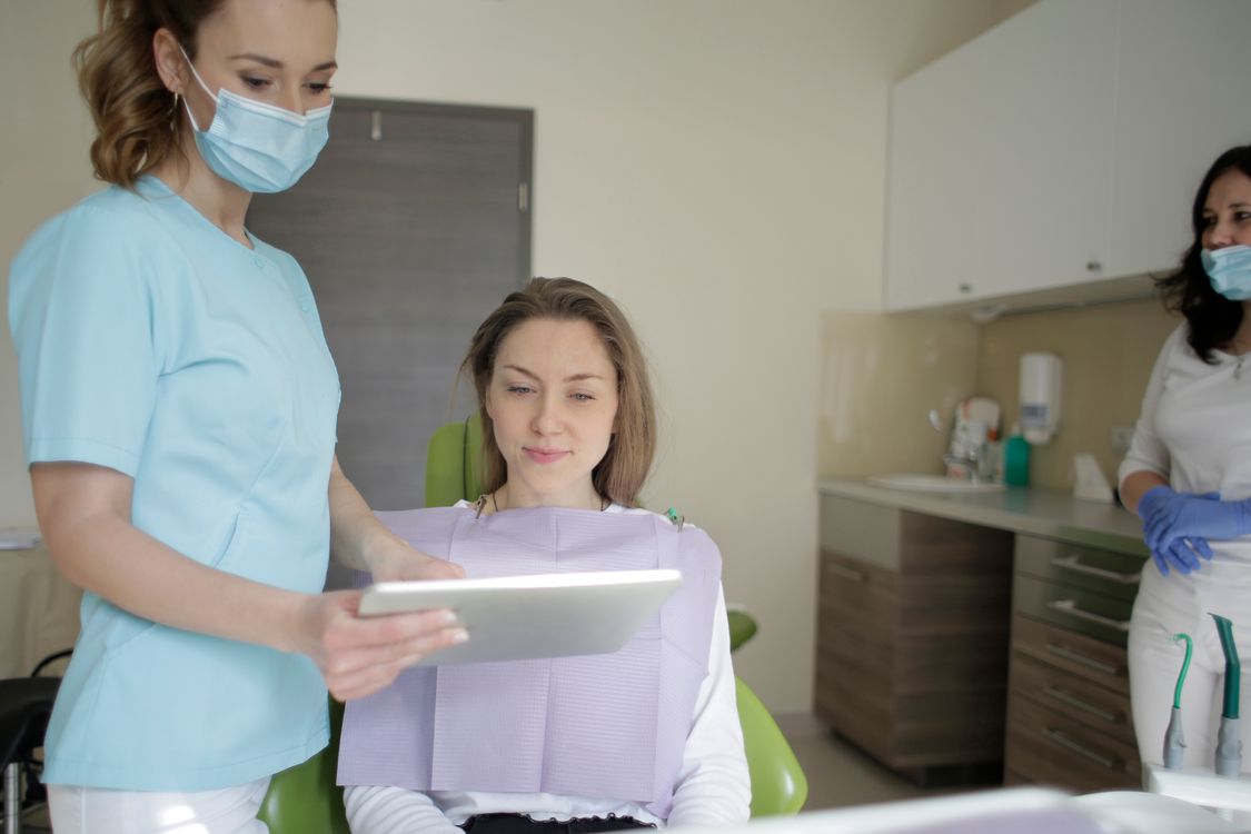 Dentist reviewing a treatment plan with a patient in a dental office