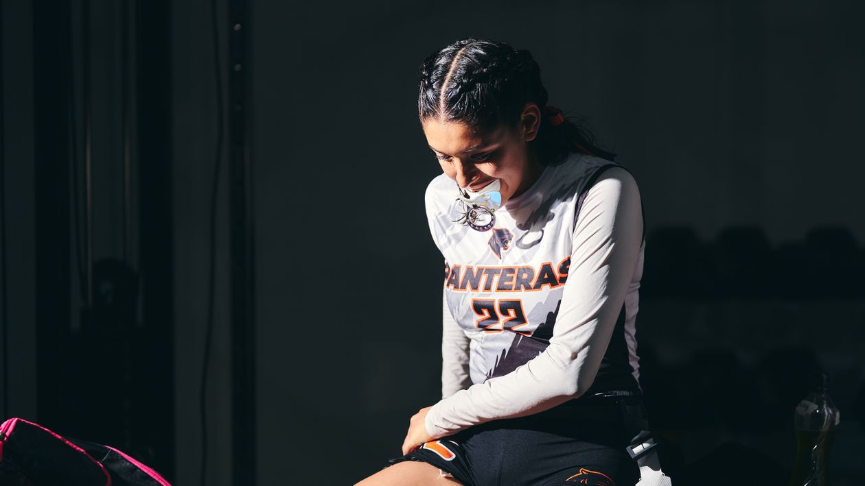 Athlete wearing a protective mouthguard while preparing for sports