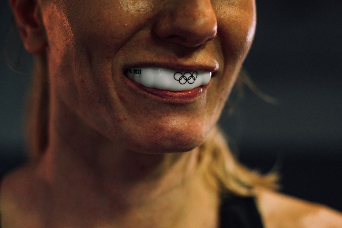 Close-up of an athlete wearing a protective sports mouthguard
