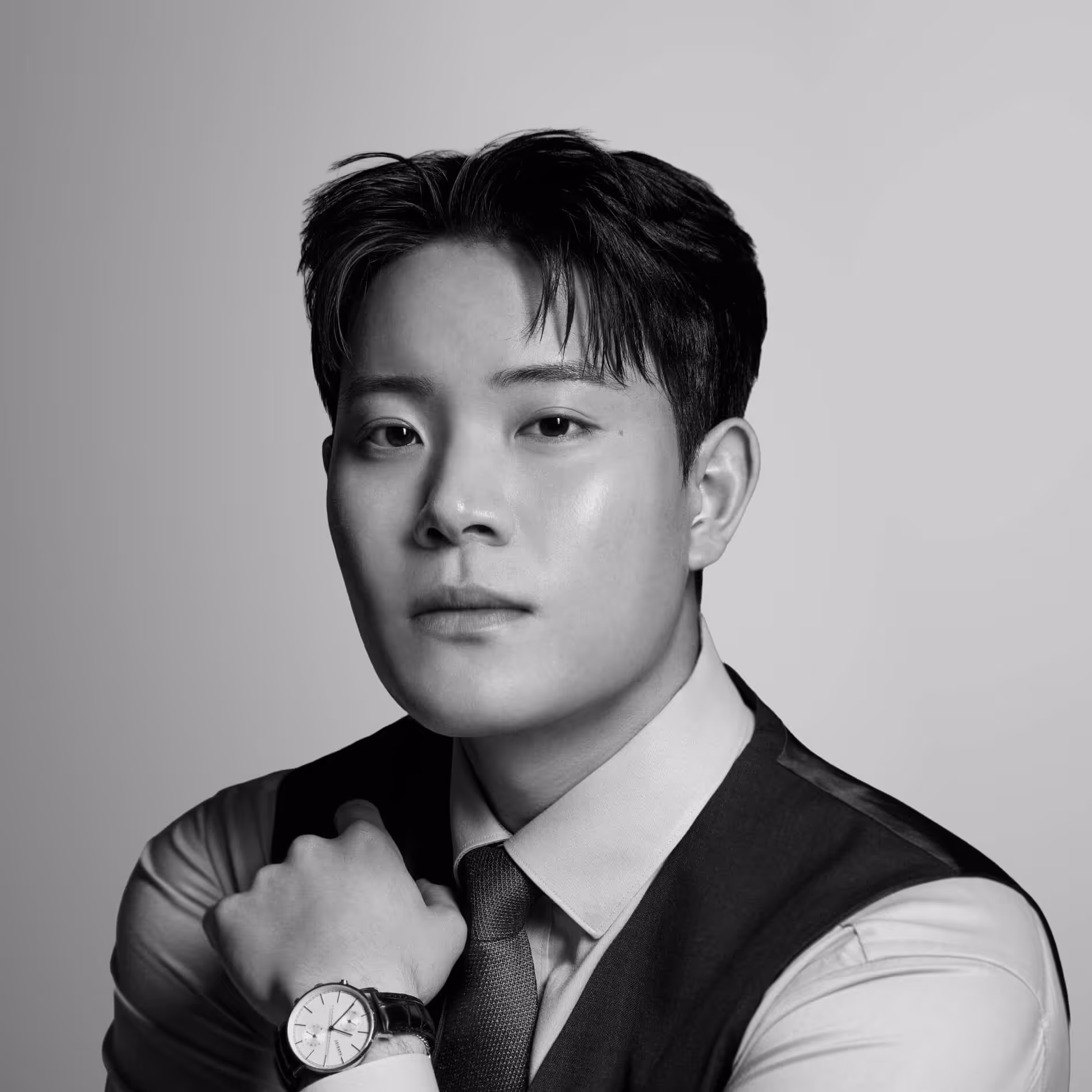 A group of men dressed in semi-formal attire ordering food at a decorated street food truck labeled Indian Soulfood at night.