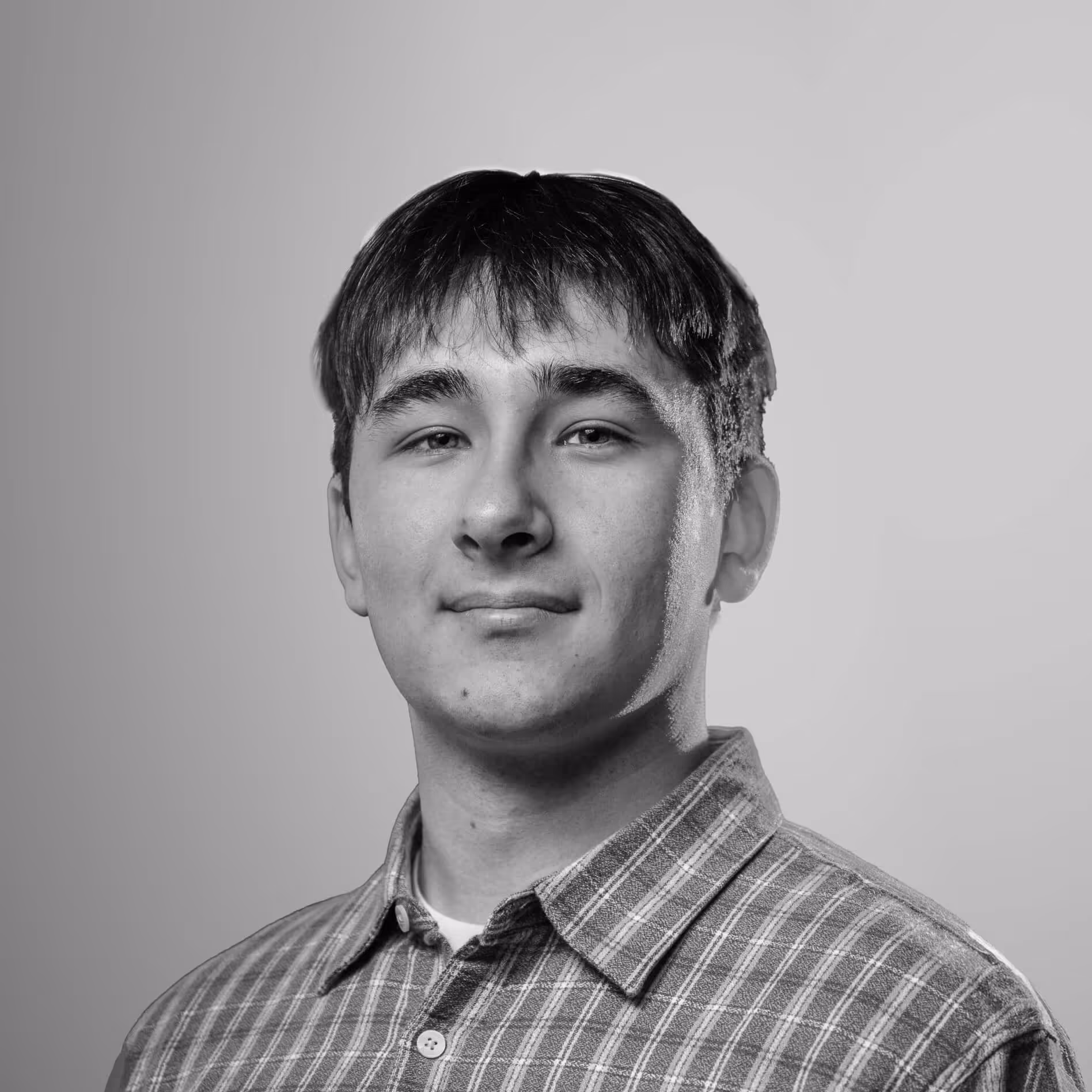 A group of men dressed in semi-formal attire ordering food at a decorated street food truck labeled Indian Soulfood at night.