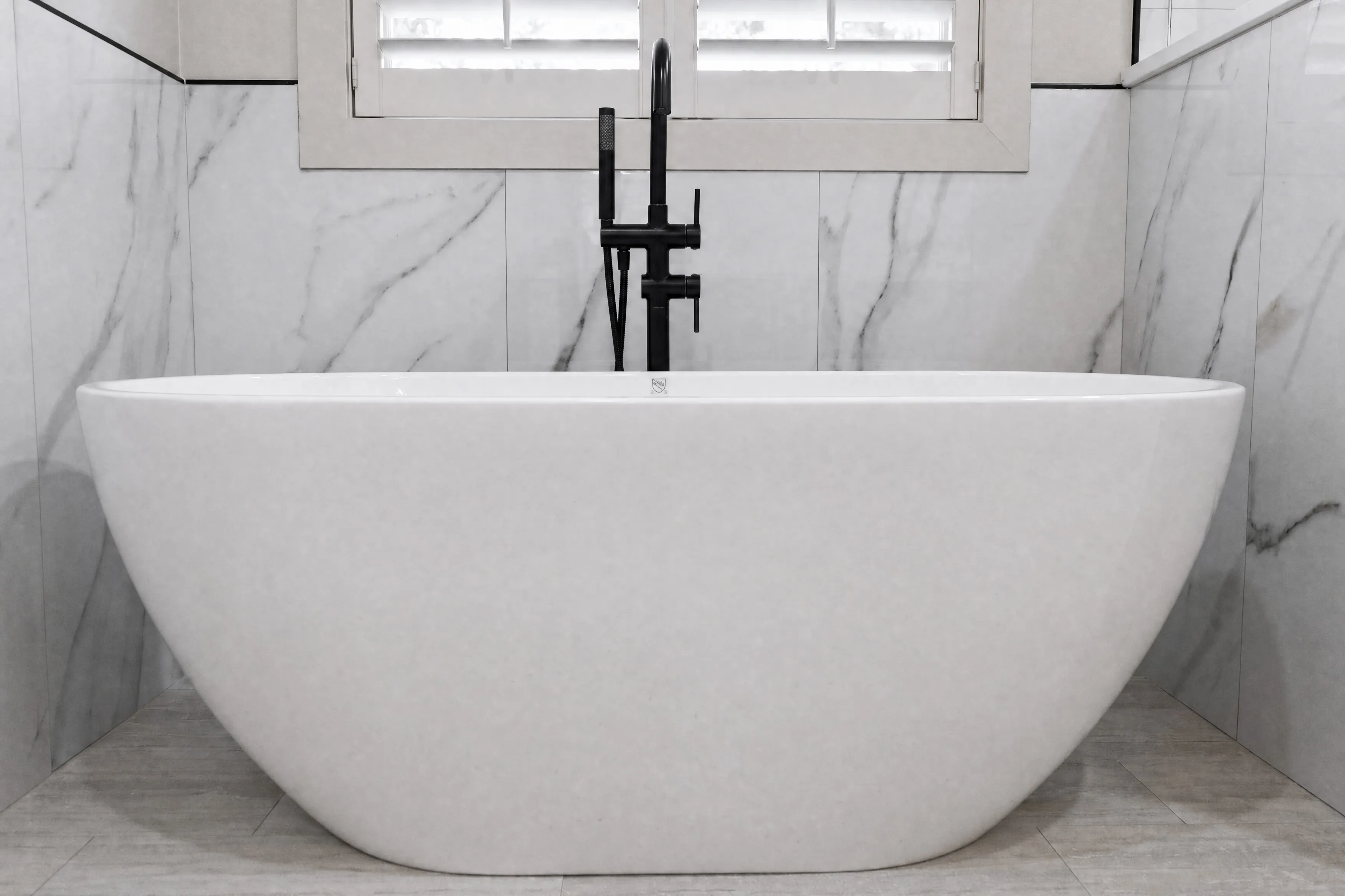 Classic master bathroom with marble tile detail