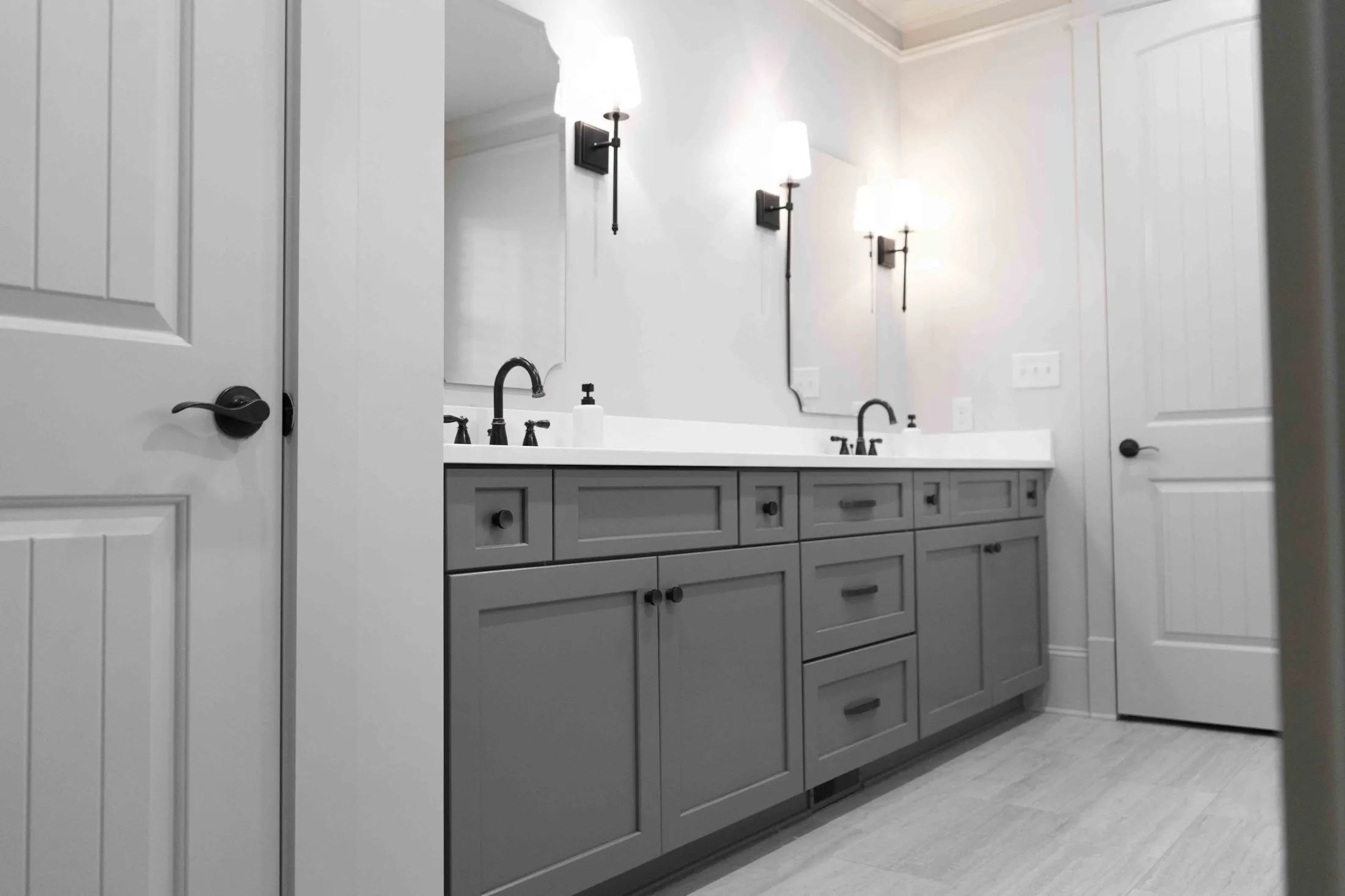Double vanity with twin mirrors and matte black fixtures