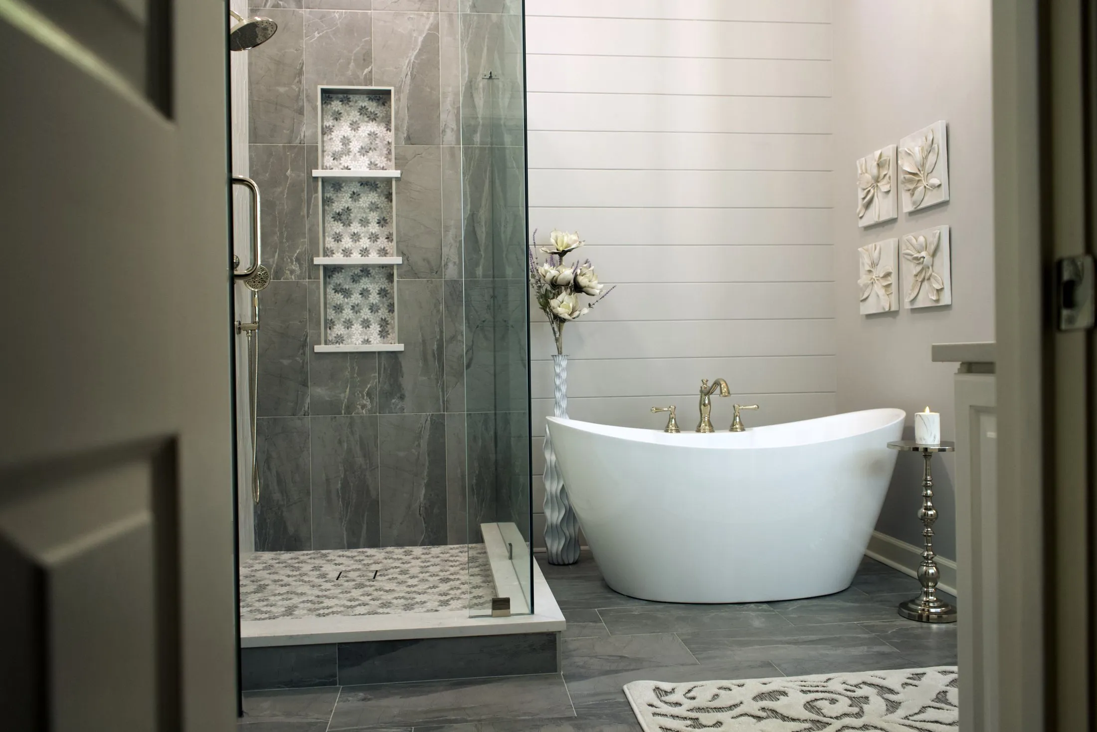 Master bathroom seen from the doorway, freestanding tub and walk-in shower