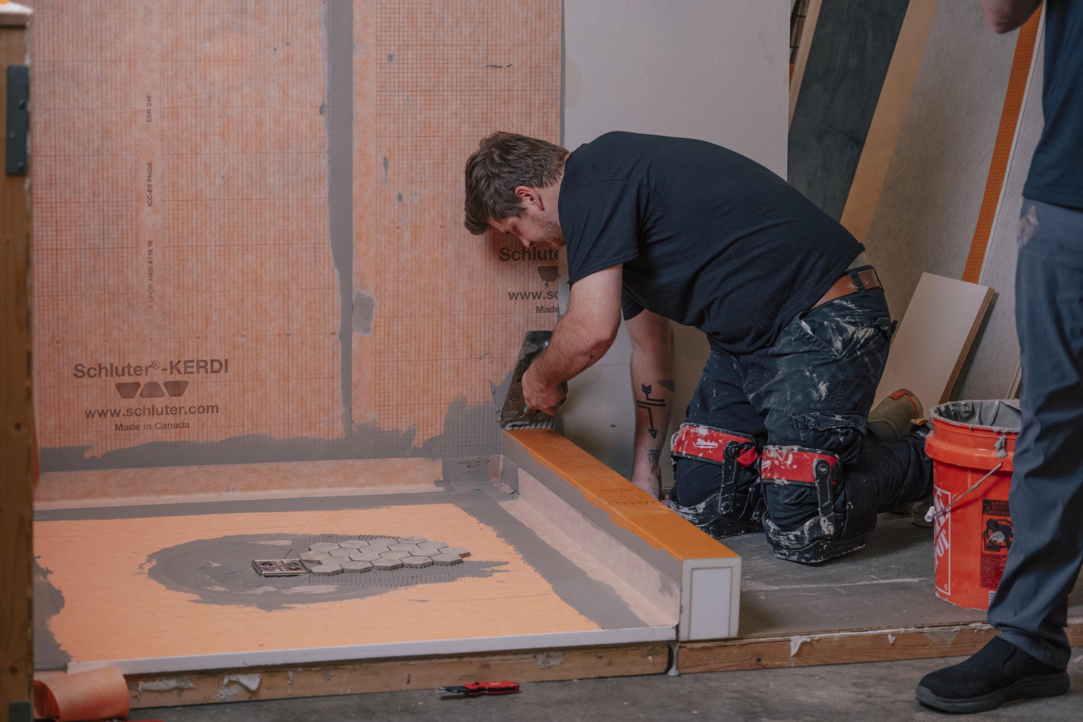 Schluter-KERDI waterproofing membrane being installed during Expertile's certification training