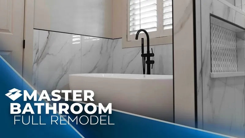 Large format marble wall behind a tub with a matte black floor mounted filler