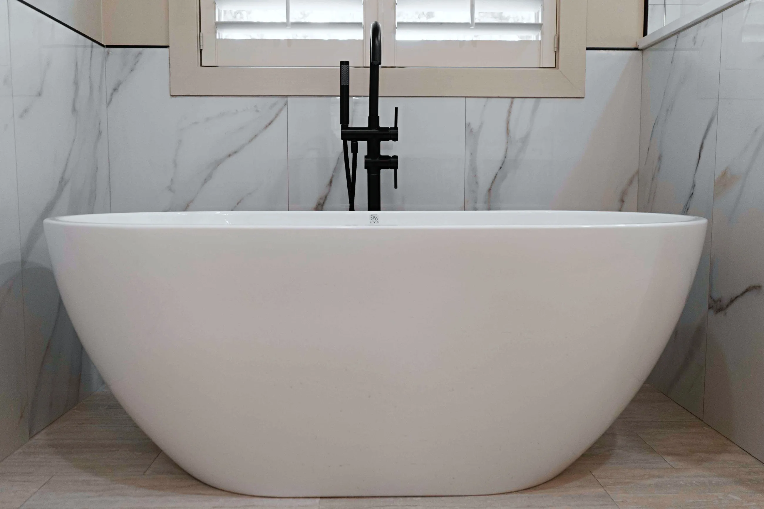 Classic master bathroom with marble tile detail