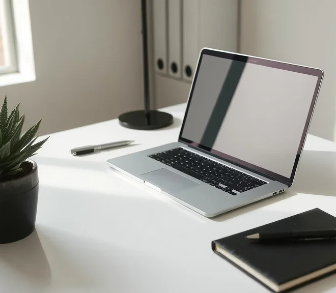 A laptop computer sitting on top of a white desk.