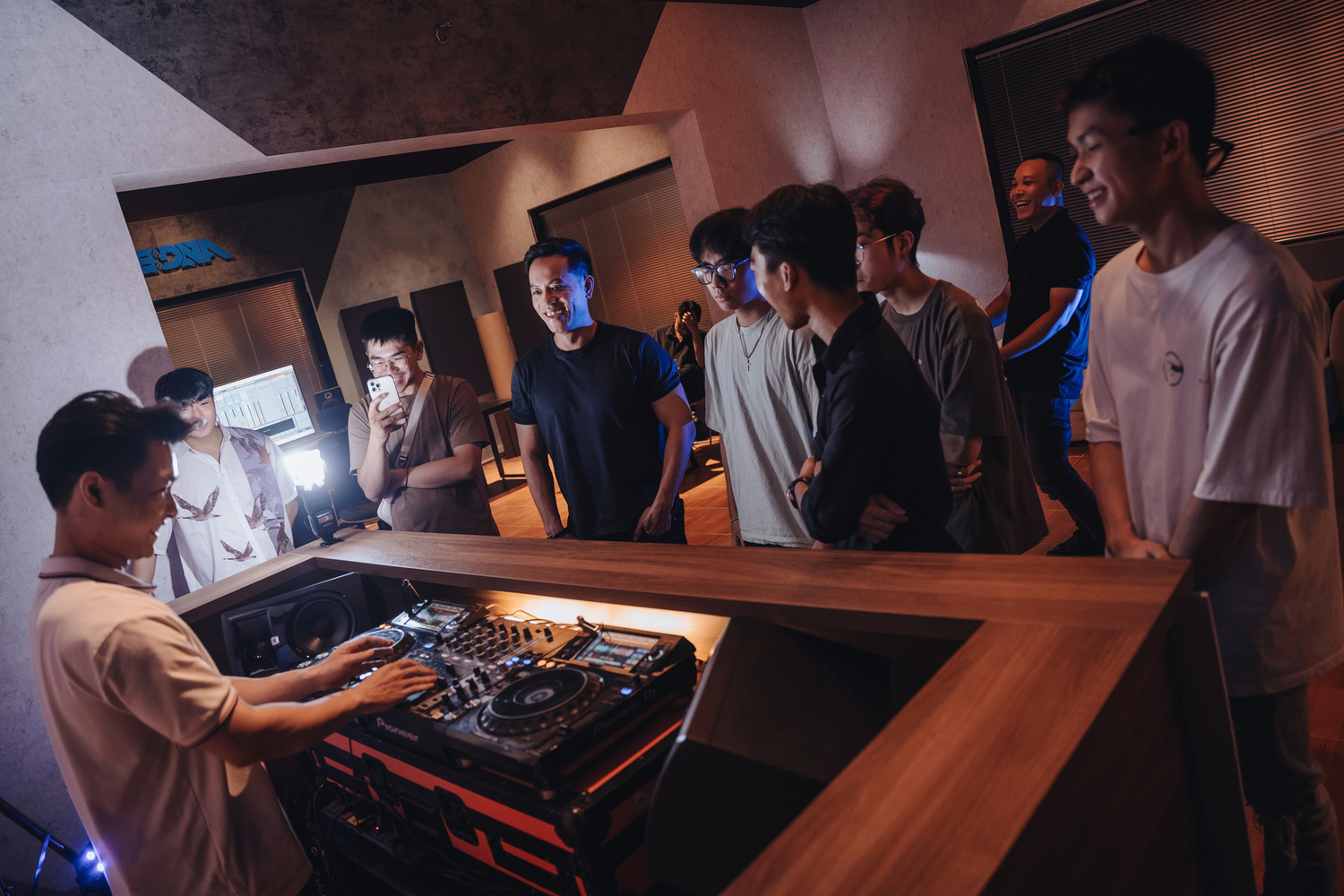 image of music producer at a console