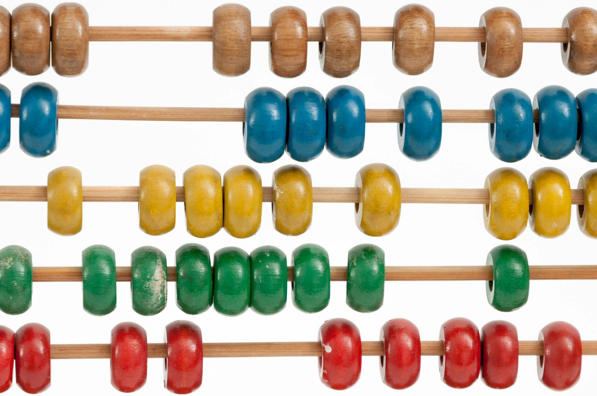 Colourful wooden counting beads on an old-fashioned wooden abacus.