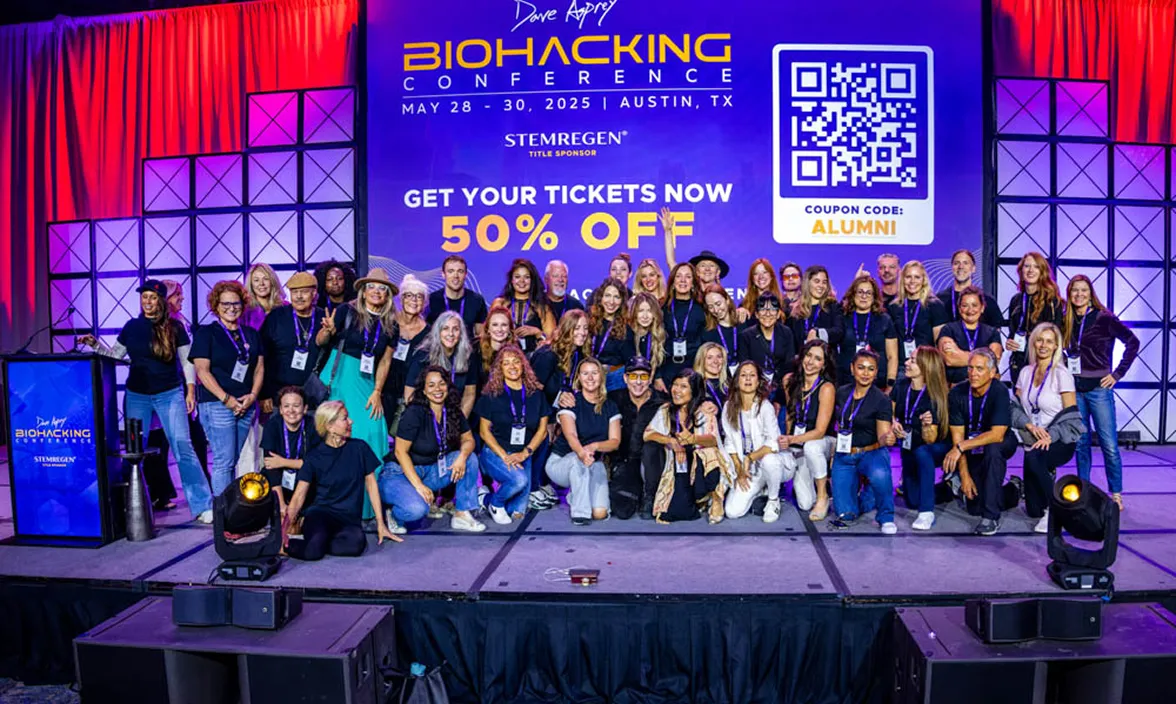 Unlimited Life team group photo at the Biohacking Conference stage