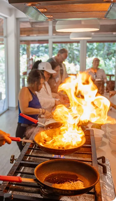 Traditional fire cooking ceremony during an immersive retreat experience