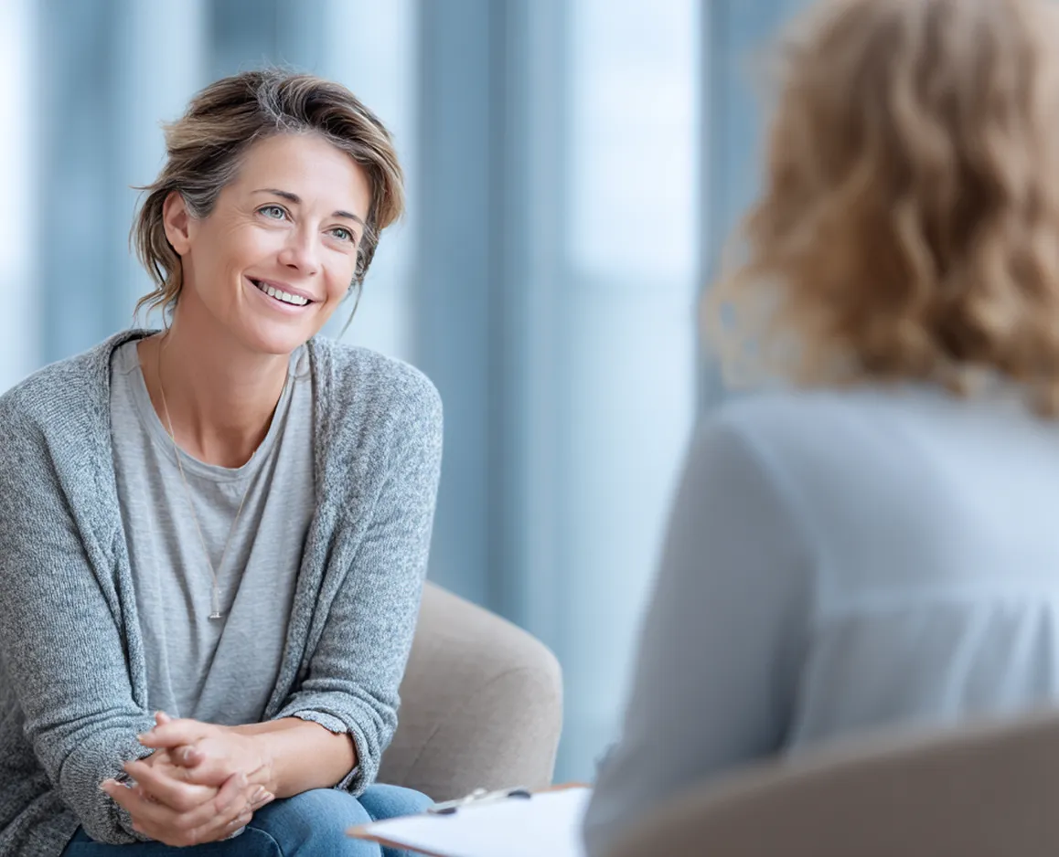 Woman smiling during a health consultation session