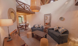 Cozy rustic lodge living room interior at an African safari retreat