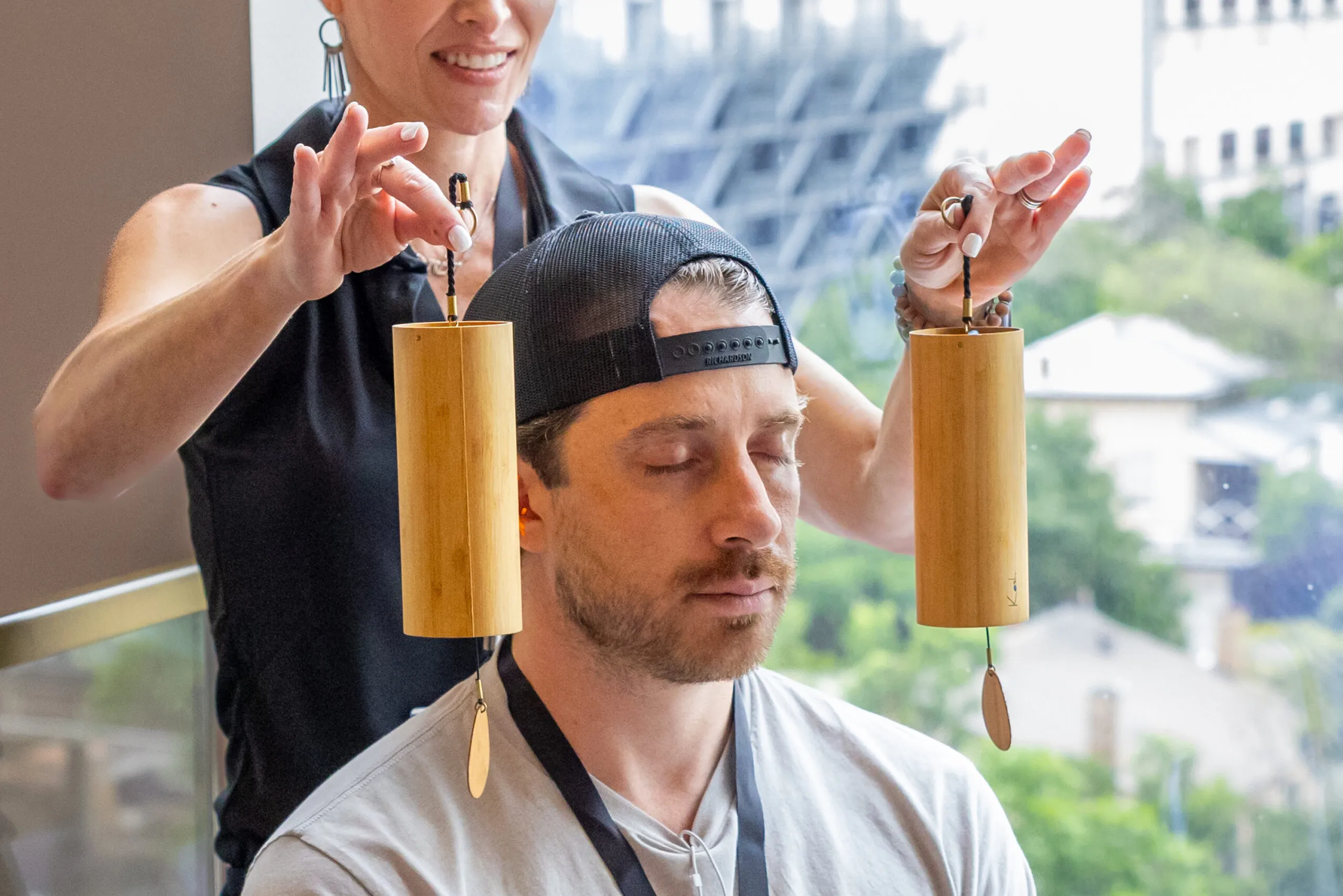 A Girl holding a biohacking device at an outdoor event