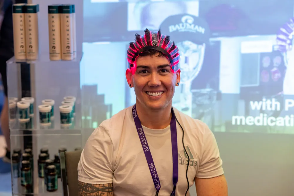 man wearing an EEG brainwave headset at a biohacking demonstratio