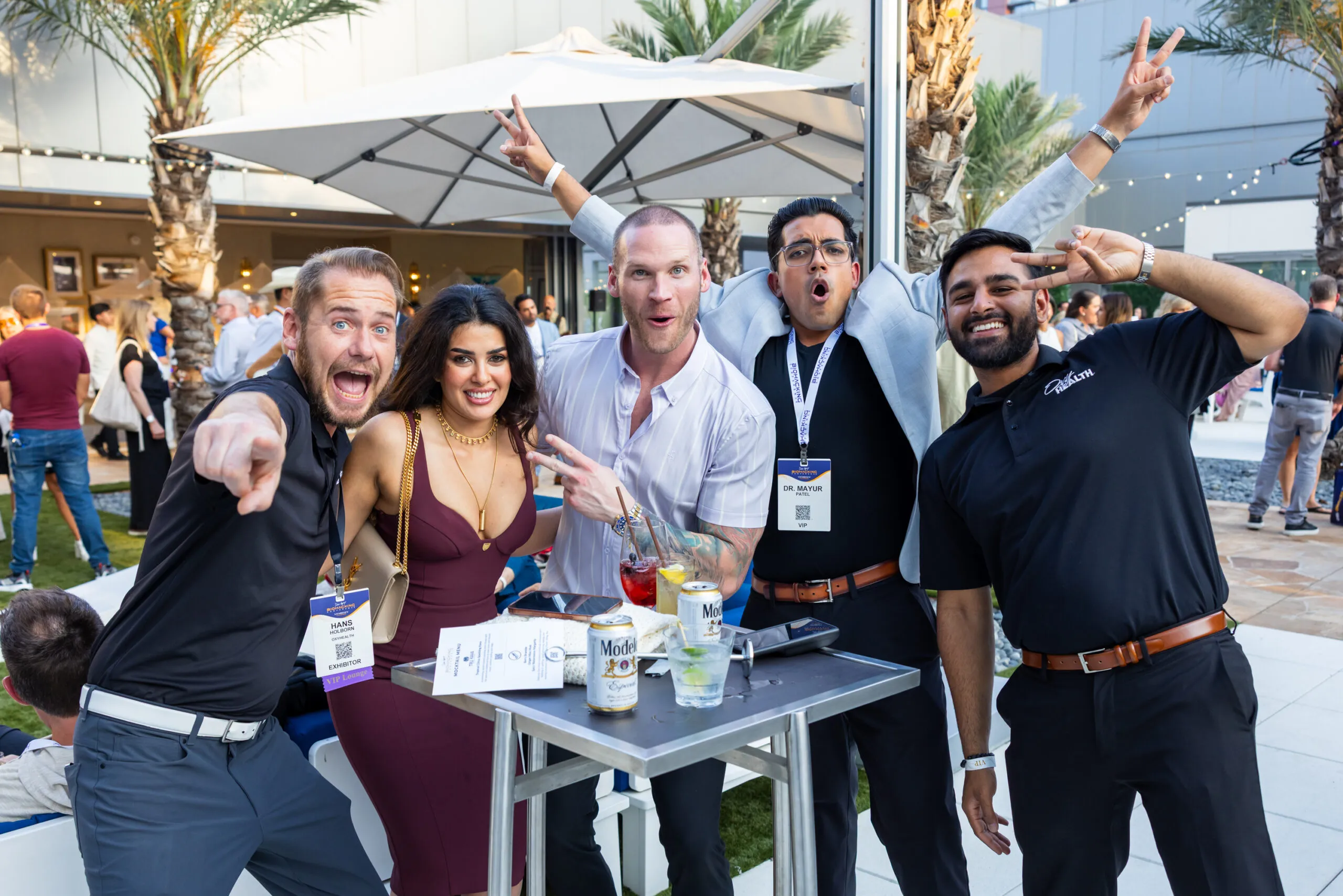 Attendees networking and socializing outdoors at the Biohacking Conference