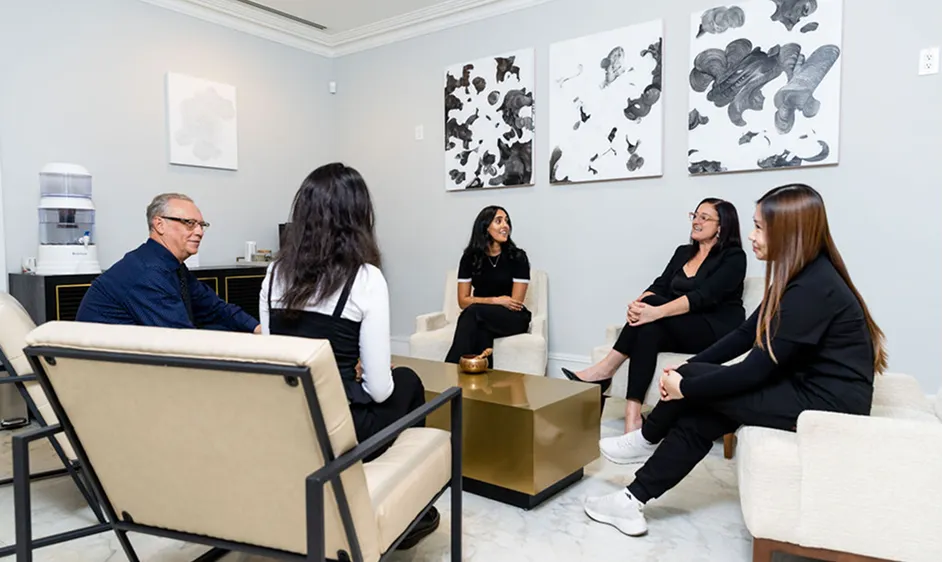 Doctor and medical team in a group consultation with patients