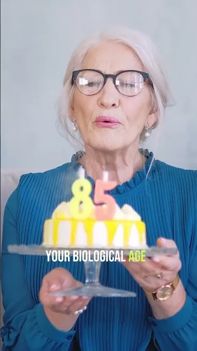 Older woman holding birthday candles in a video about biological age