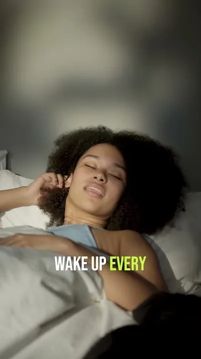 Person waking up in bed in a video about morning routines