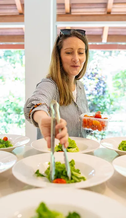 Woman preparing a healthy meal following a nutrition protocol