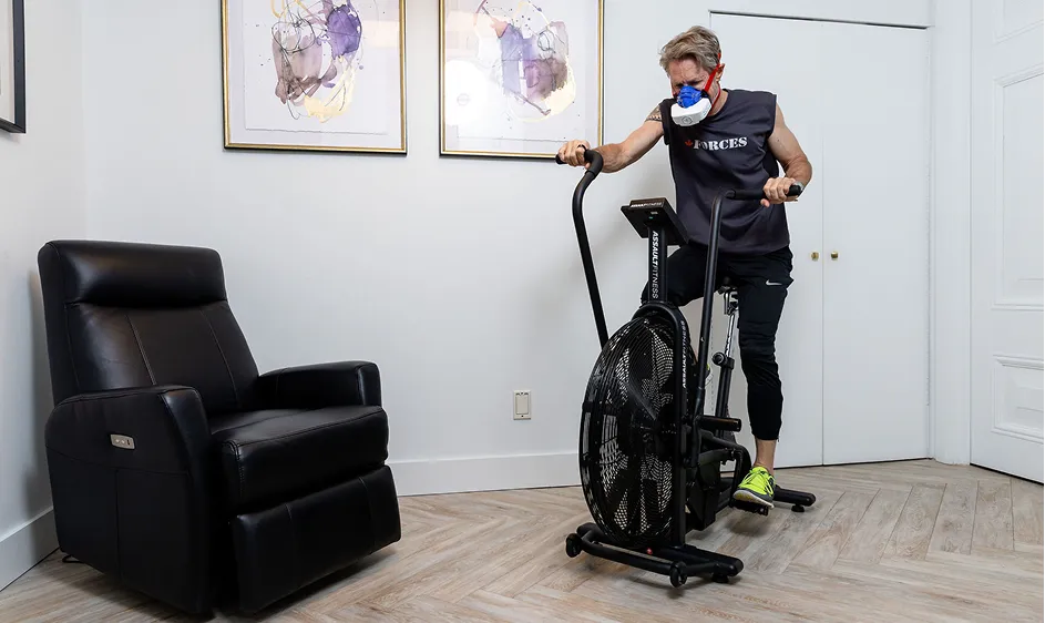 Patient using an exercise bike during a fitness assessment