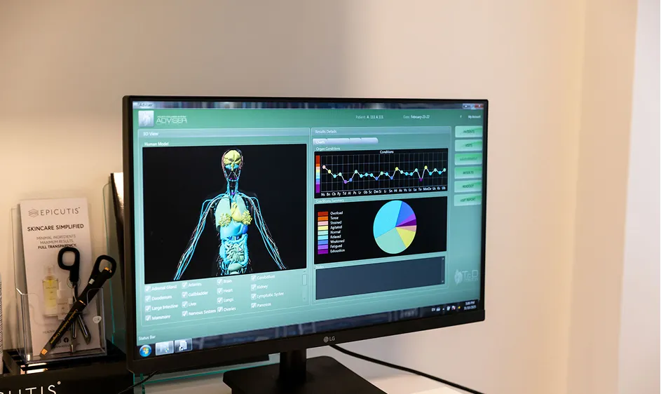 Biometric health analysis software displaying a 3D human body scan on a monitor