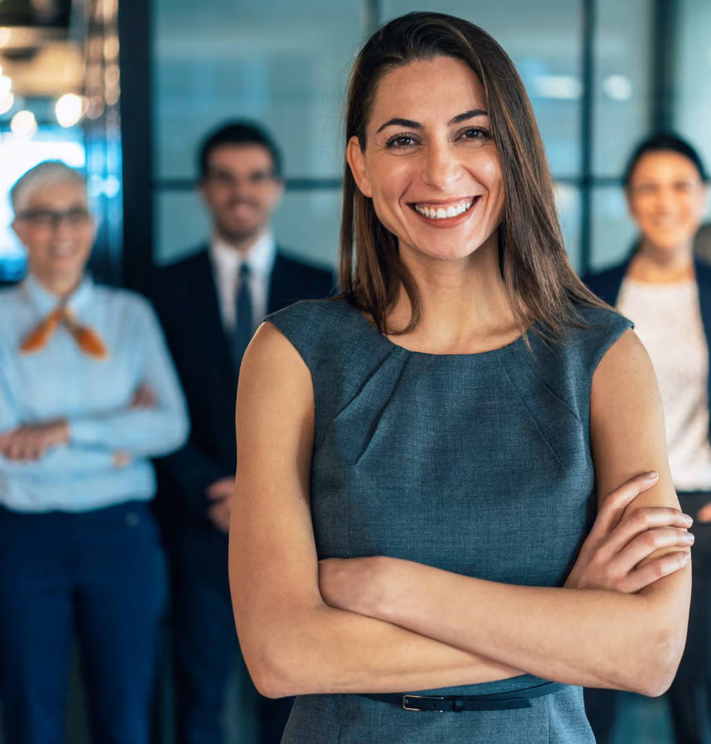Woman smiling in front of group of professional adults