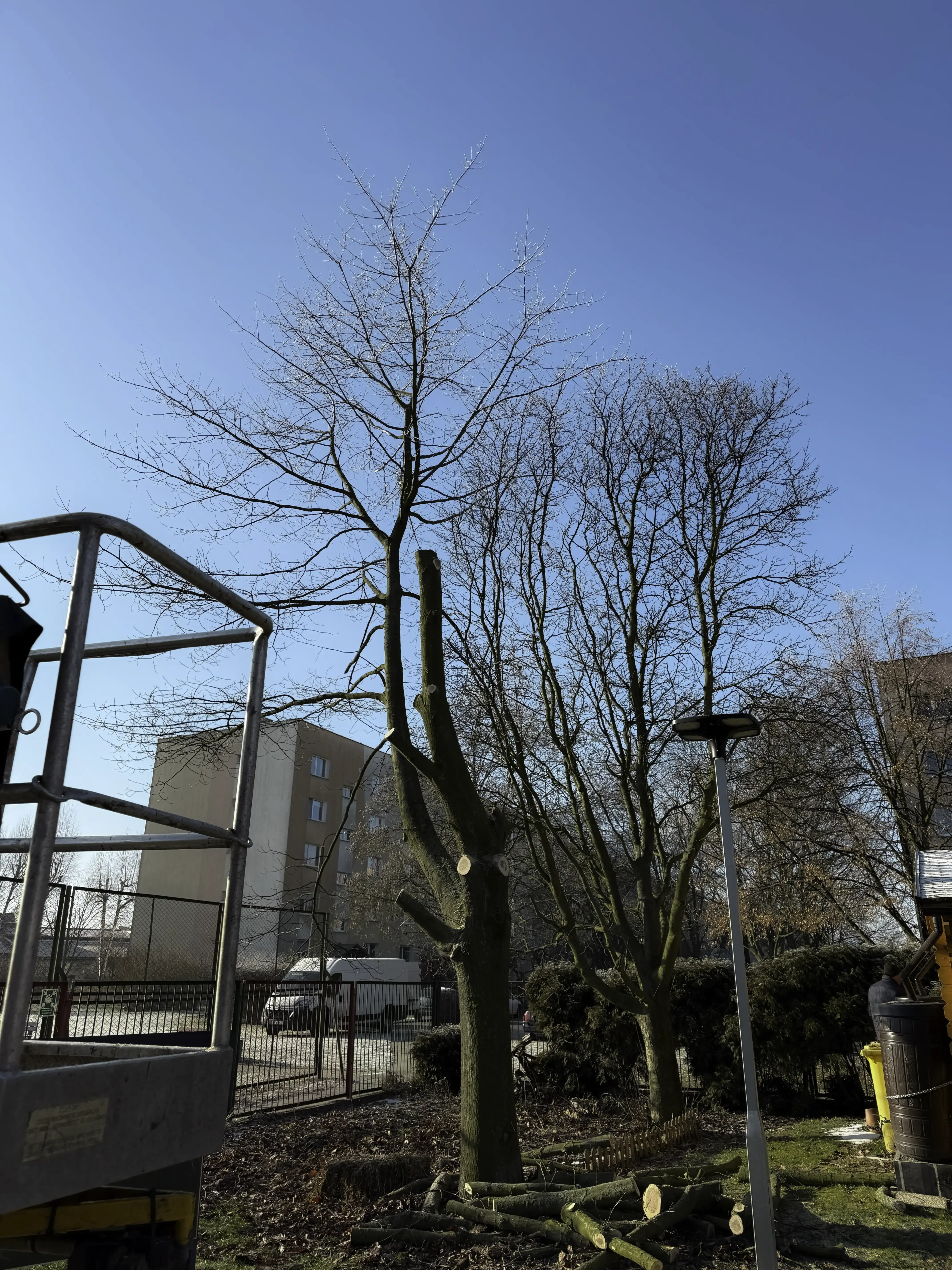 Smooth flowing black satin fabric with soft light reflections and gentle folds.