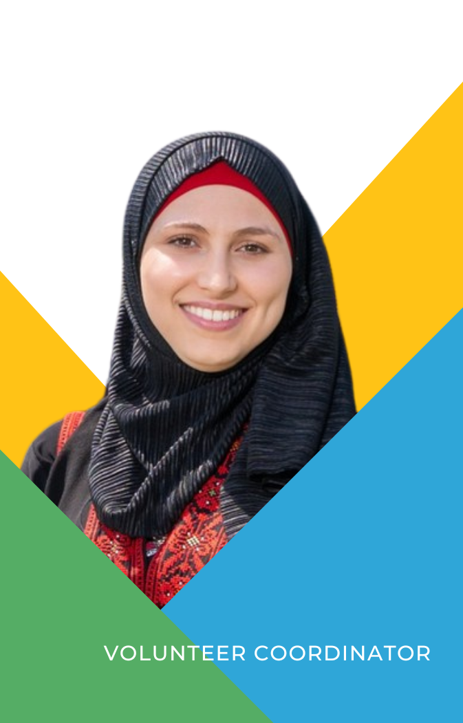 Smiling woman wearing a black hijab and traditional red embroidered clothing labeled Volunteer Coordinator.