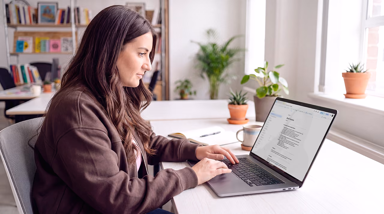 Sara working at her desk at Gravita