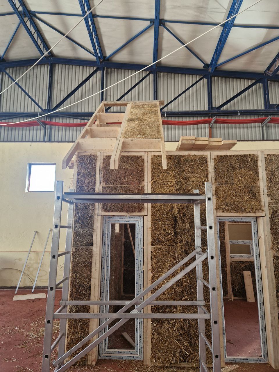 Assembling the Barn 4×6 test house in the production workshop