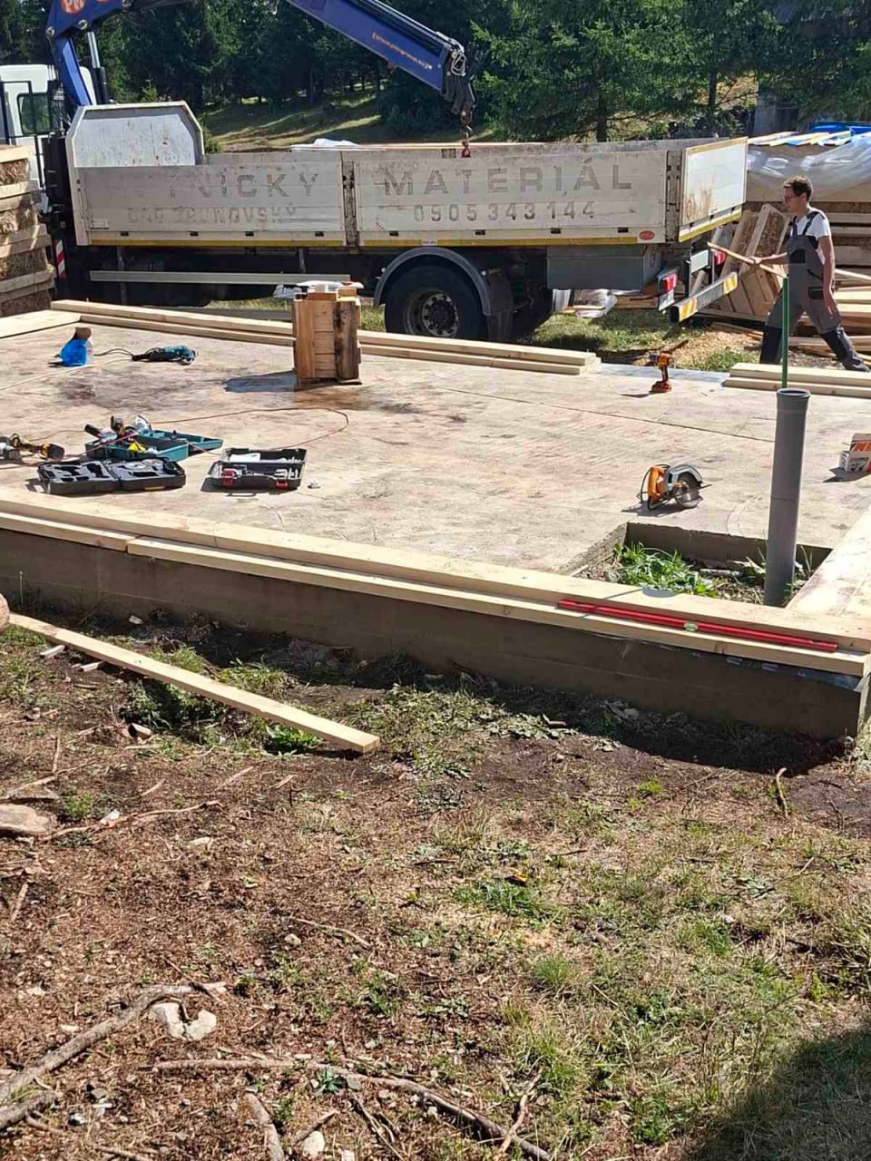 Assembling the timber base frame for the A-frame 5×7 house