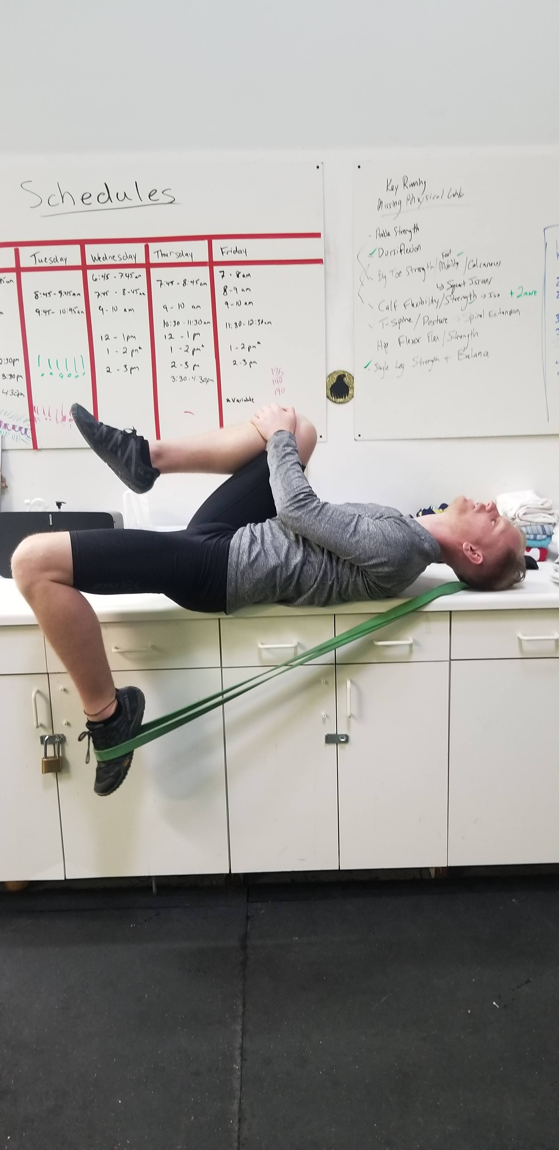 image of a personal trainer guiding a client through a workout