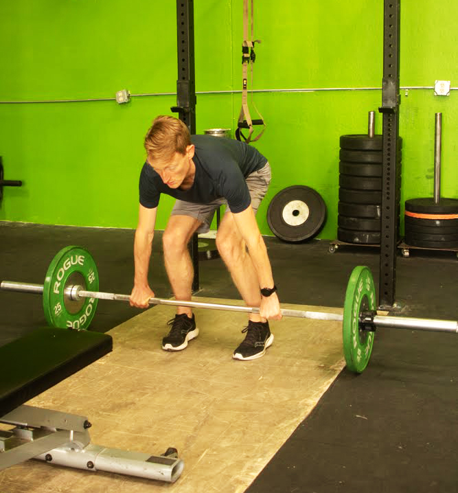 image of a personal trainer guiding a client through a workout