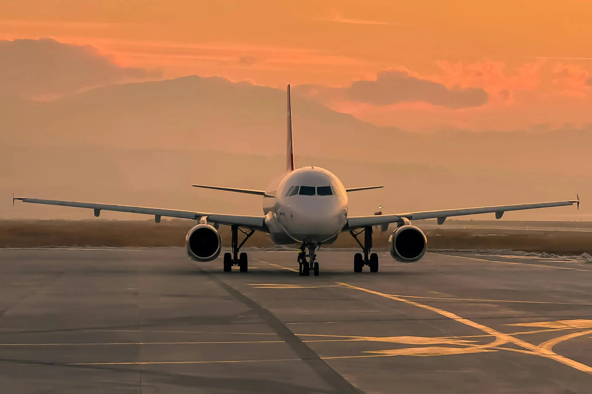 airplane in golden sunset on runway