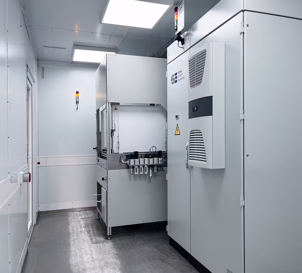 Clean, white industrial container room housing a hydrogen and fuel cell test bench.