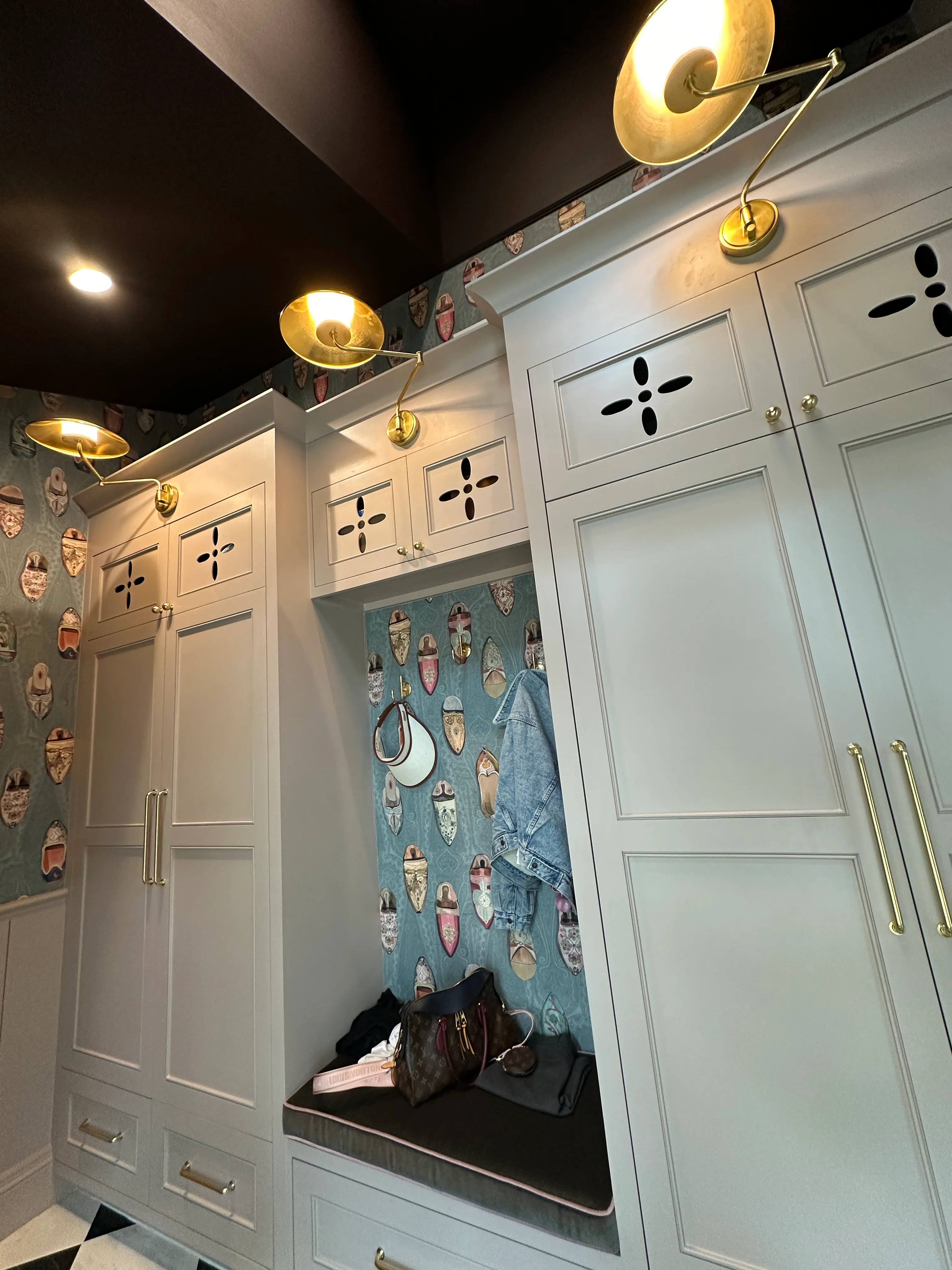Built-in cabinetry nook with patterned wallpaper
