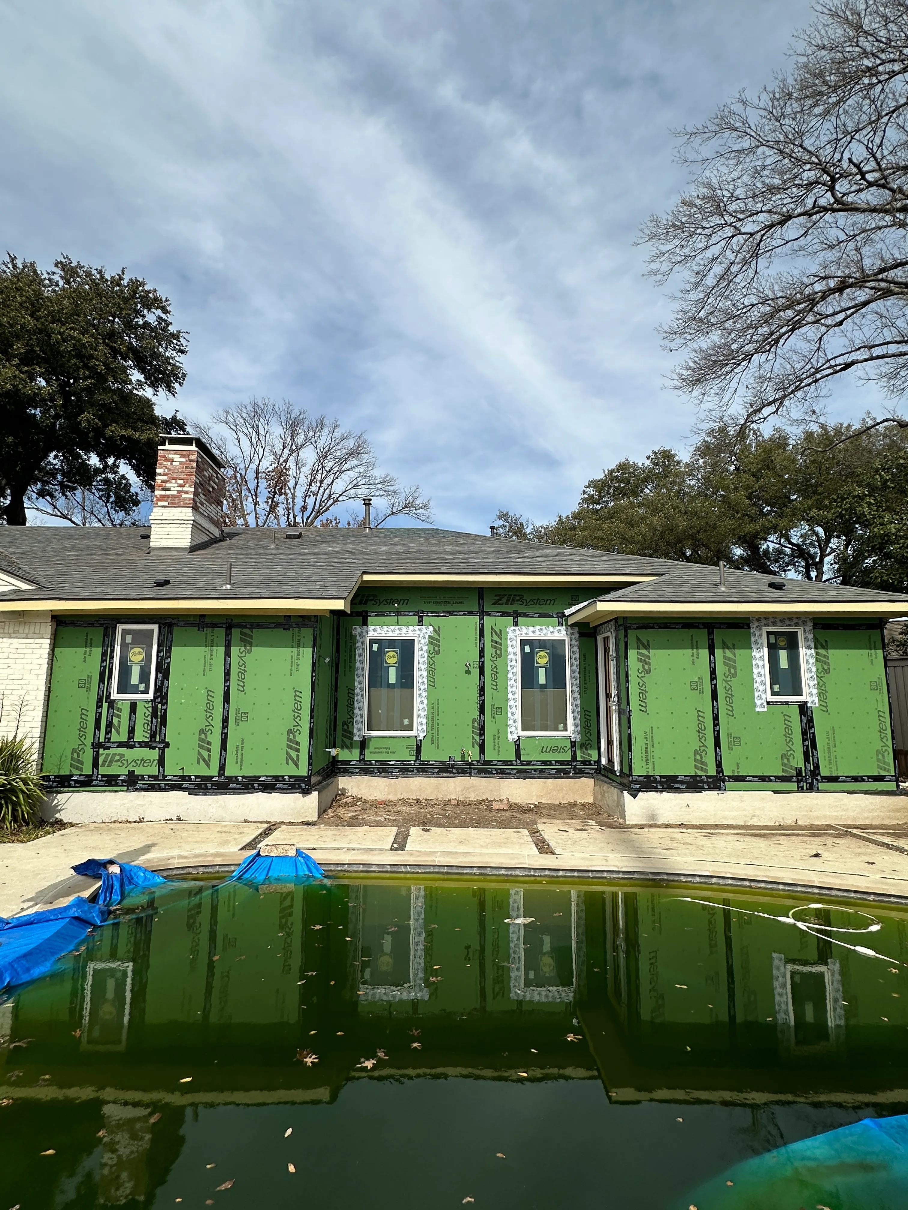 East wing exterior wrapped in ZIP sheathing during construction