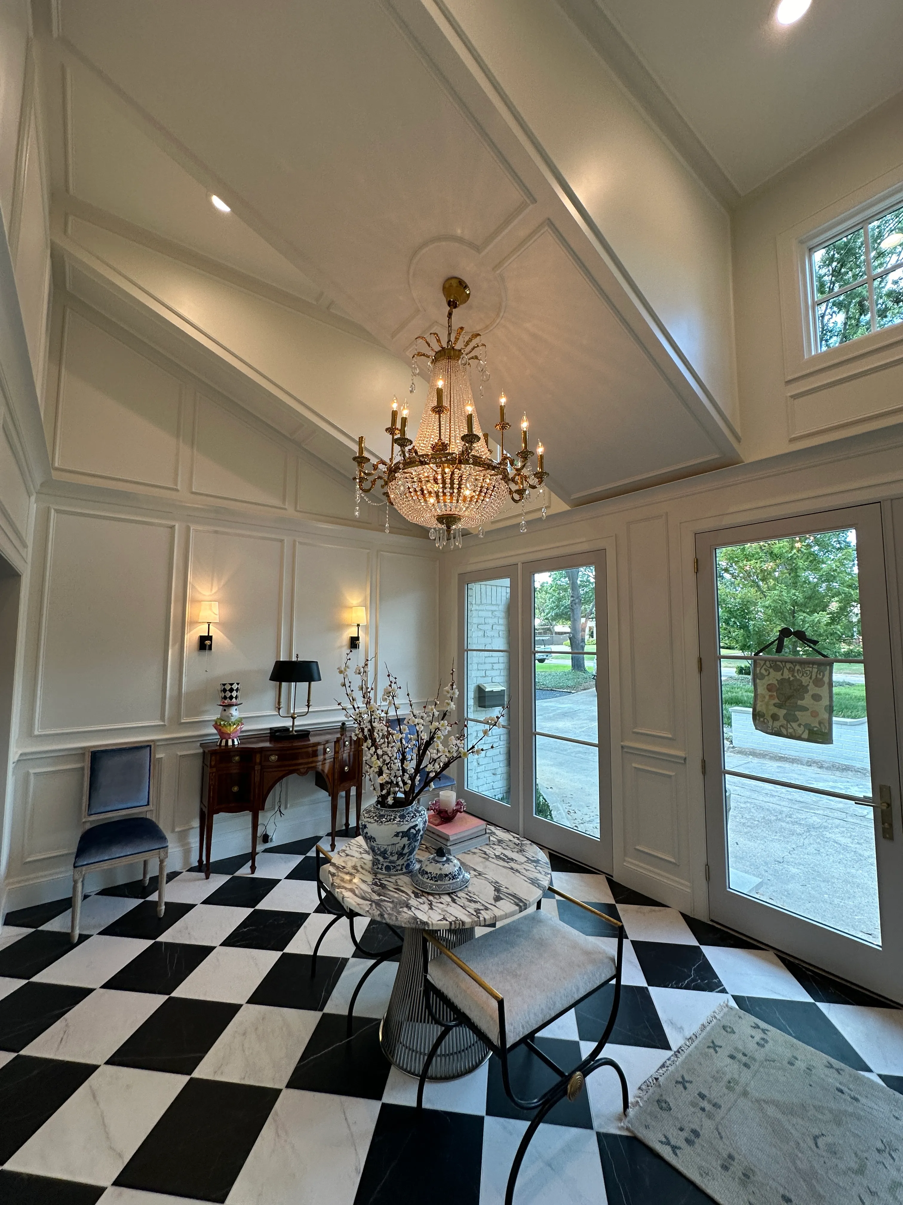 Foyer ceiling millwork and crystal chandelier