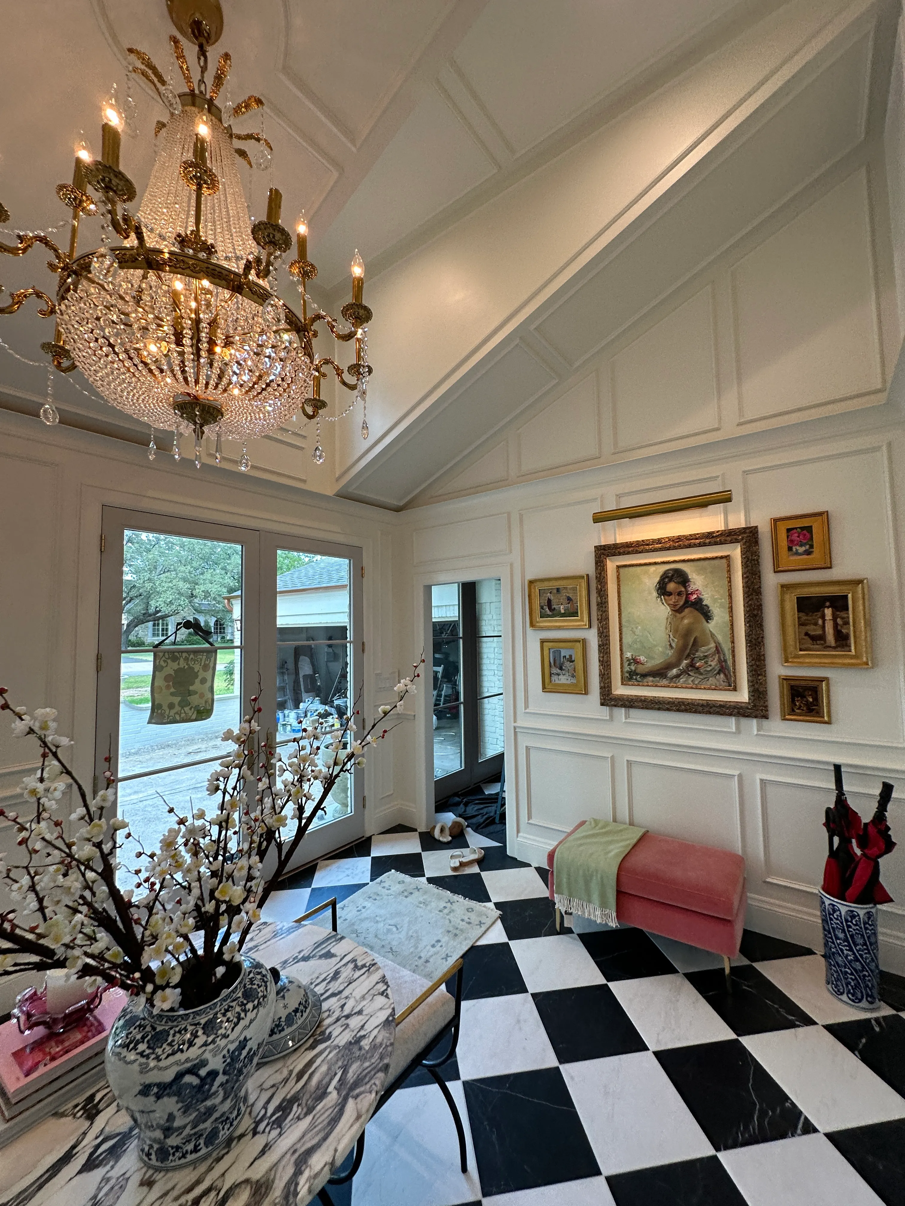 Foyer with chandelier and checkerboard marble floor
