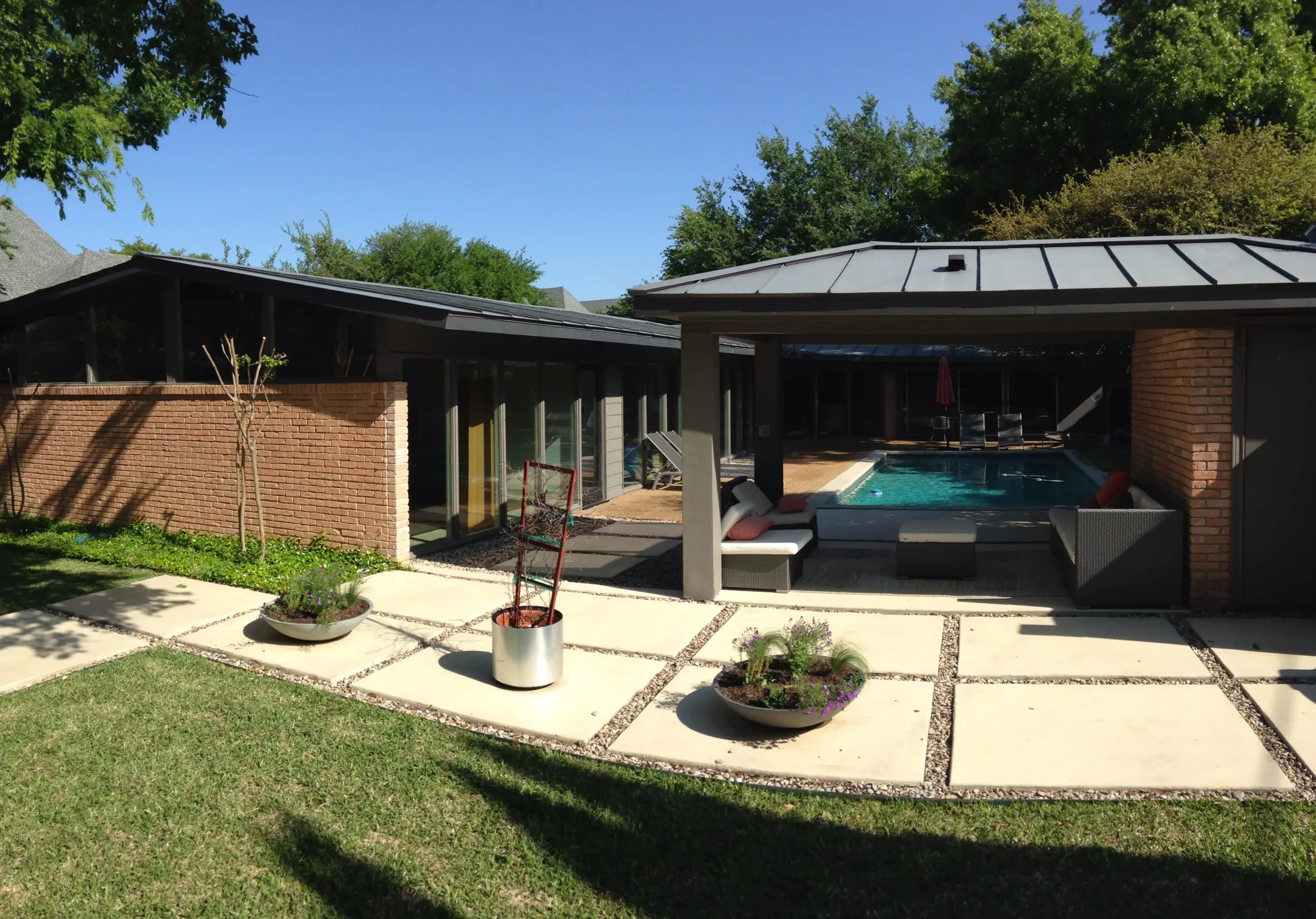 Mid-century modern home with courtyard pool and concrete paver patio