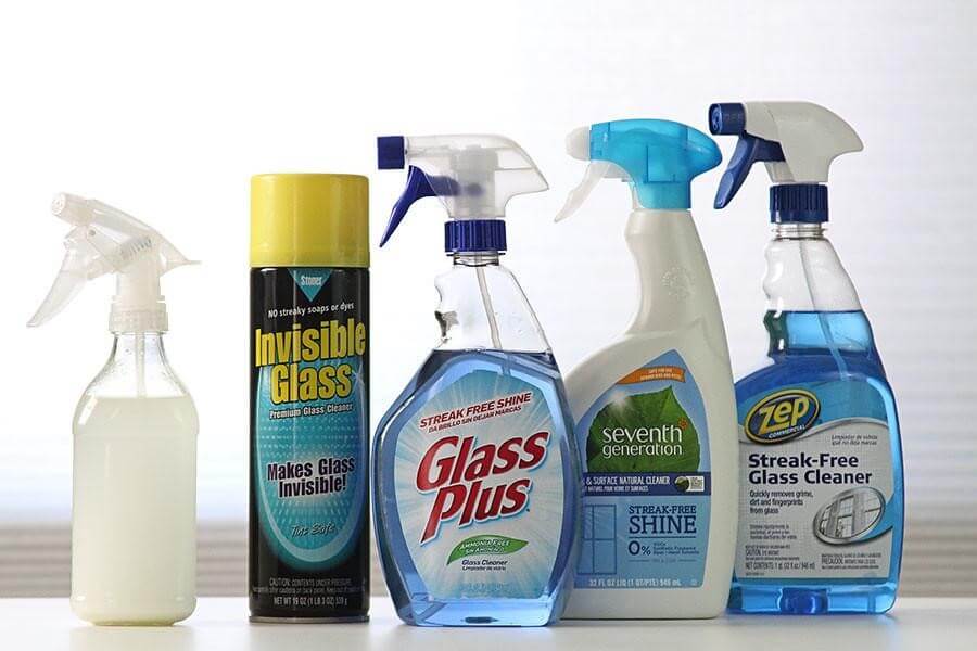 How do professional window washers clean windows?