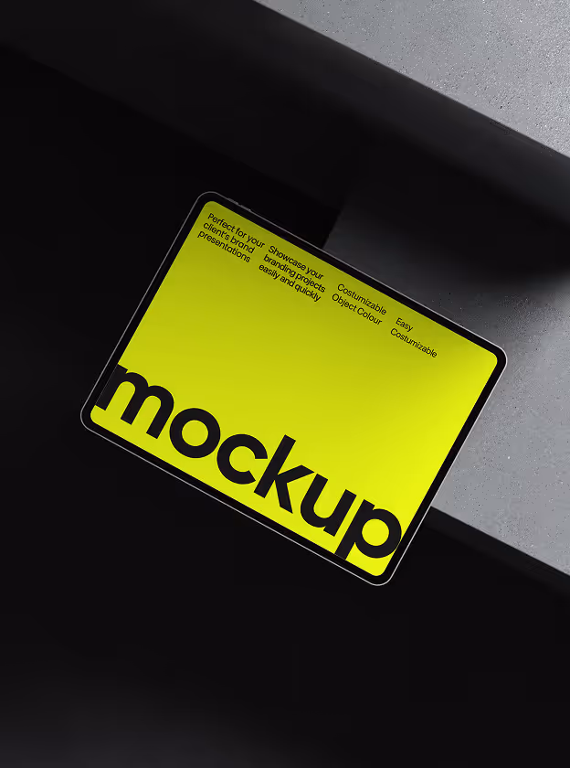 Tablet with a bright yellow-green screen displaying the word 'mockup' in large black letters and small text highlighting customizable features.