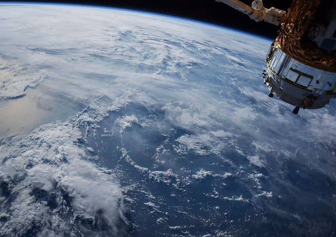earth from space and a satellite