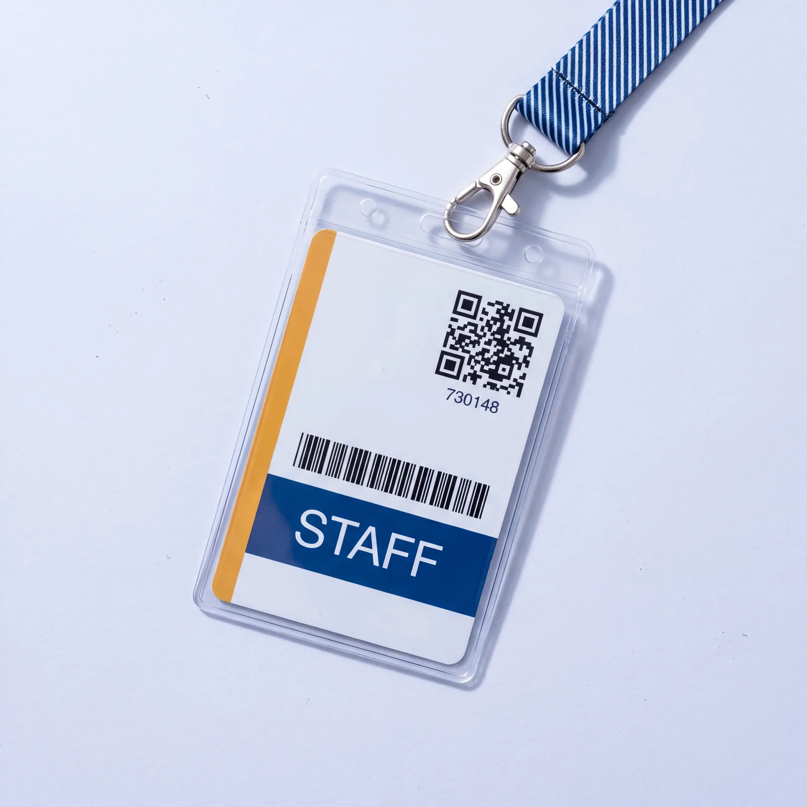A blank ID card in a clear badge holder on a navy woven lanyard